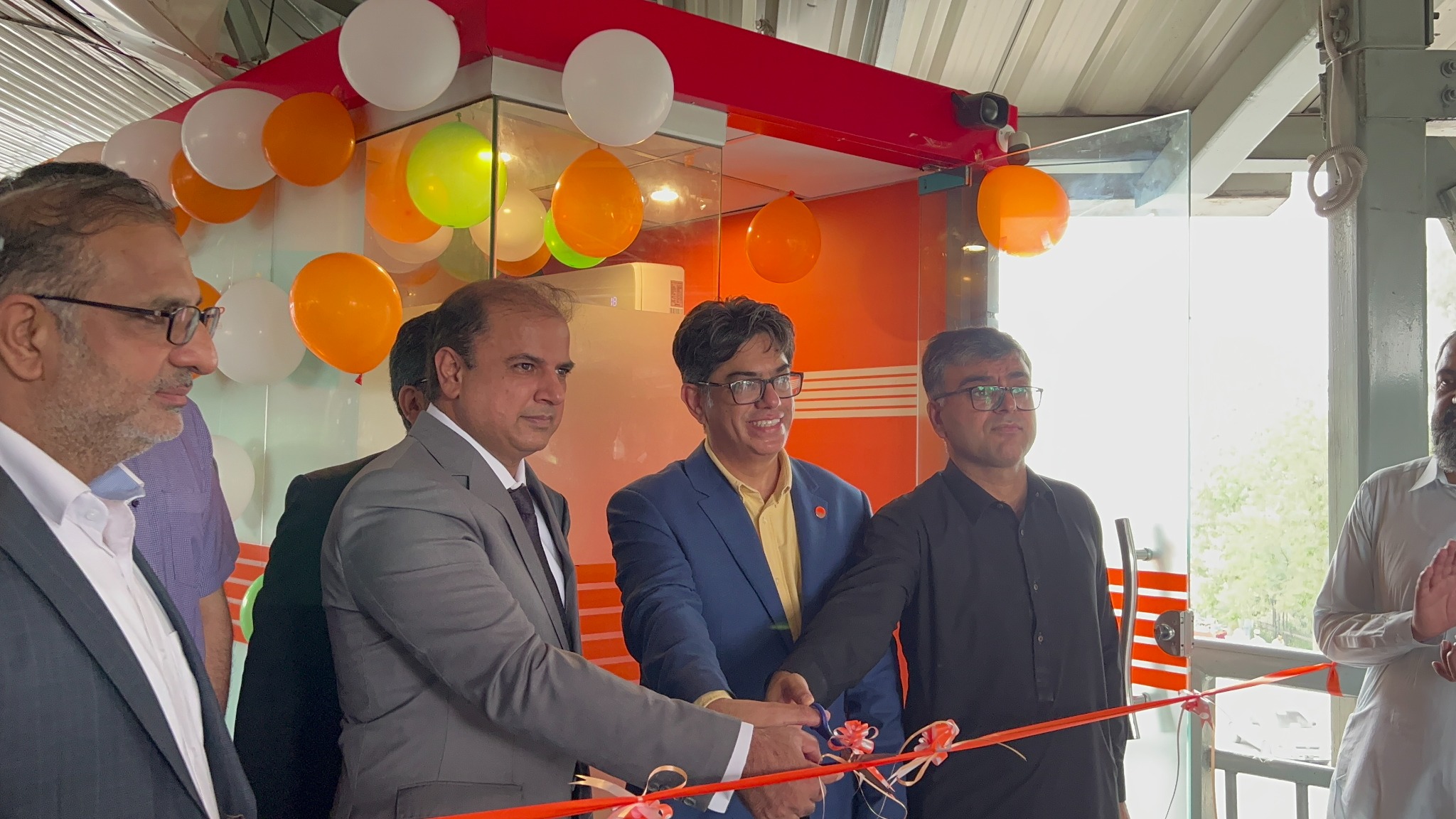 Ribbon-cutting ceremony at an ECOMS site inauguration